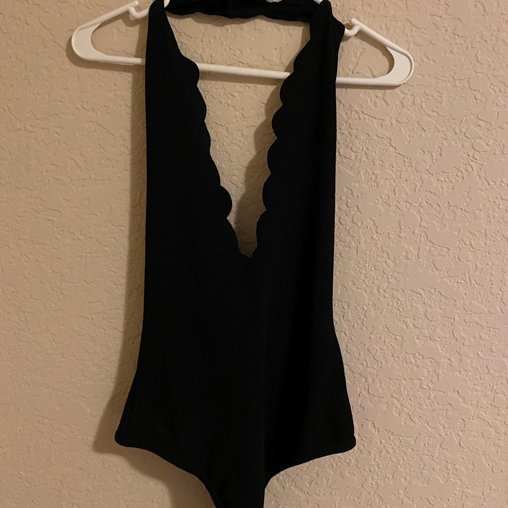 Black bodysuit with V neck detailing in front